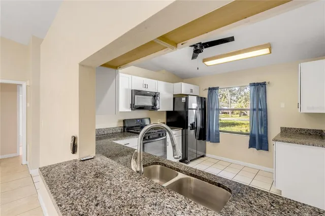 a view of a living room and a sink