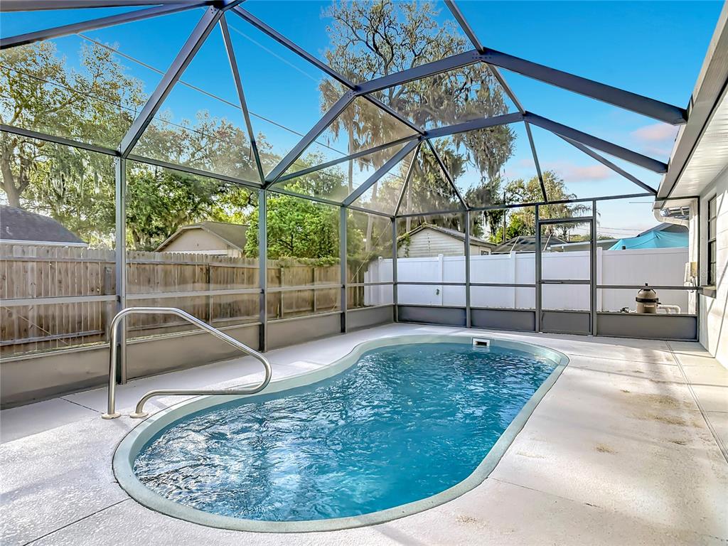 612 Devon Street Port Orange, FL 32127 - Photo 27 of 34 a view of a swimming pool with a patio