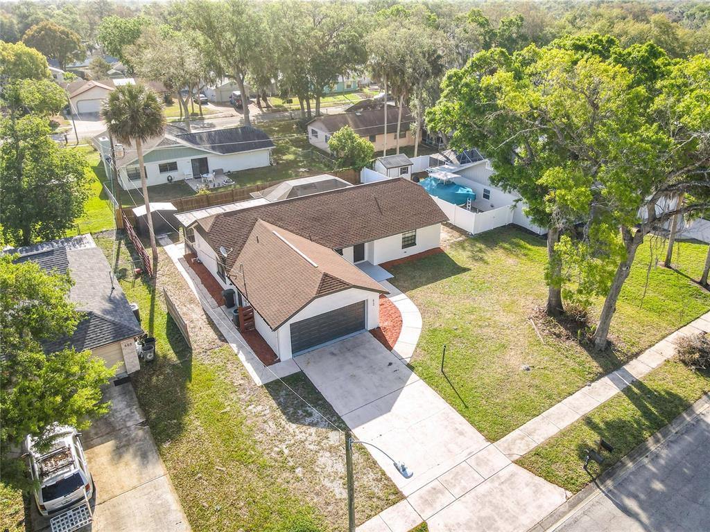 612 Devon Street Port Orange, FL 32127 - Photo 4 of 34 a view of a swimming pool with a patio