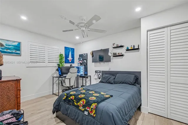 a bedroom with furniture and windows