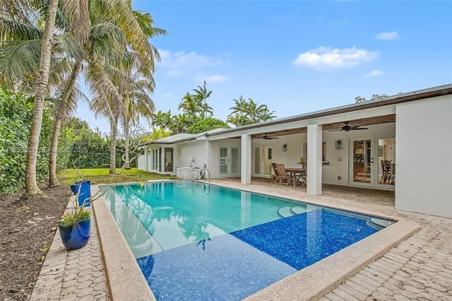 swimming pool view with seating space