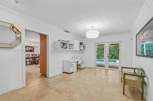 a bedroom with furniture and a window