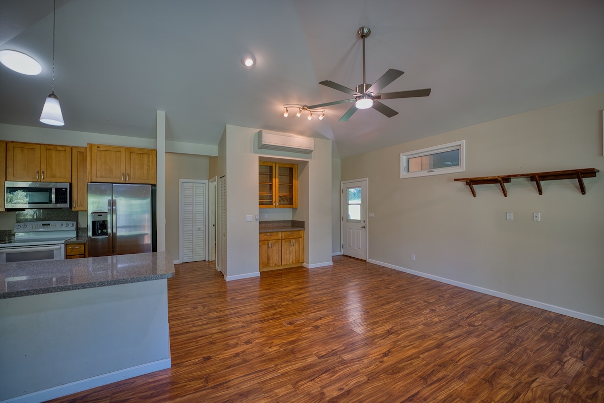 127 Opio Road Hilo, HI 96720 - Photo 16 of 21 a view of an empty room with window and wooden floor
