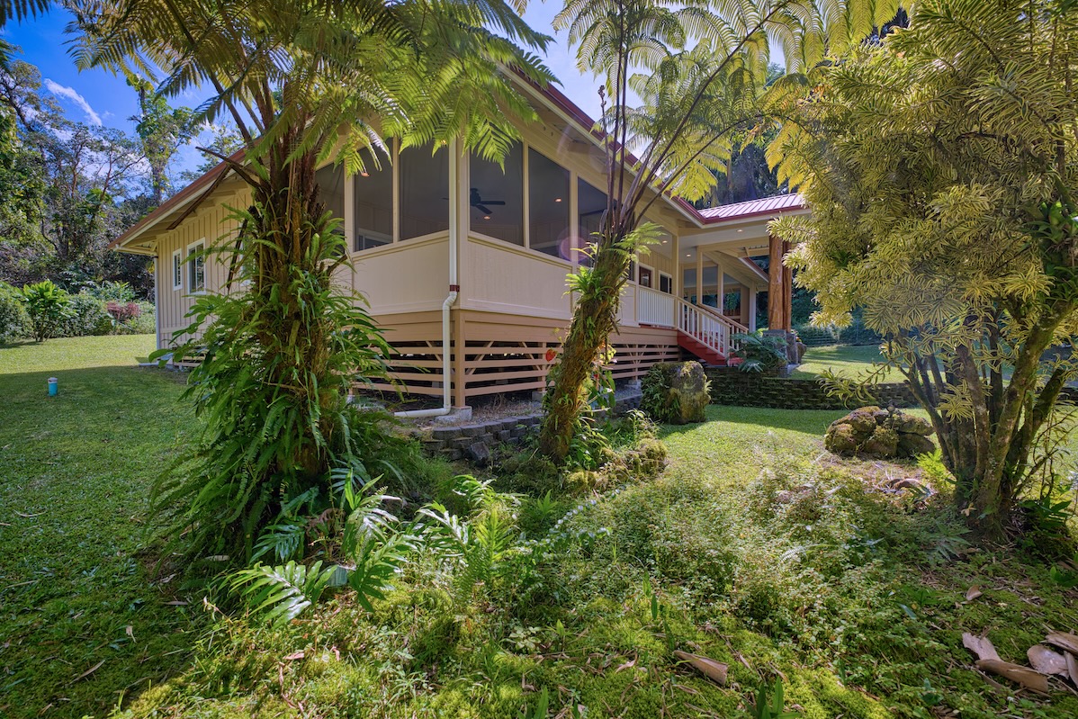 127 Opio Road Hilo, HI 96720 - Photo 17 of 21 a front view of a house with a yard
