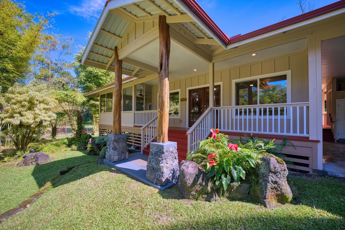 127 Opio Road Hilo, HI 96720 - Photo 3 of 21 a view of a chair and table in the garden