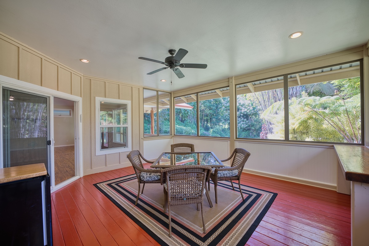 127 Opio Road Hilo, HI 96720 - Photo 10 of 21 a view of a dining room with furniture window and outside view