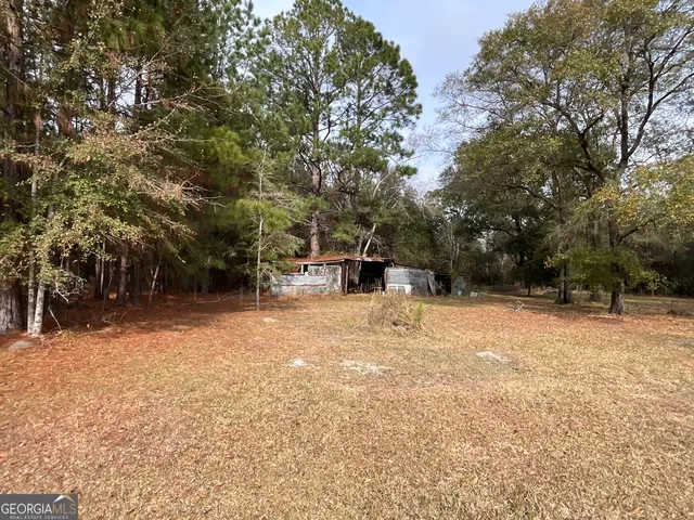 a backyard of a house with lots of green space