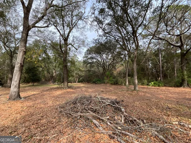 an aerial view of waterside residential house with outdoor space