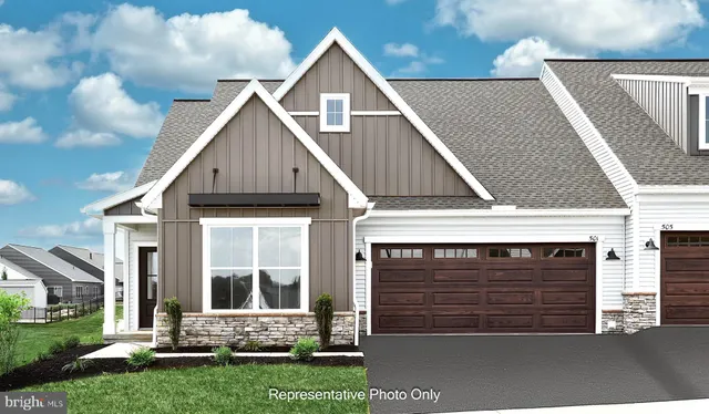 a view of house with yard