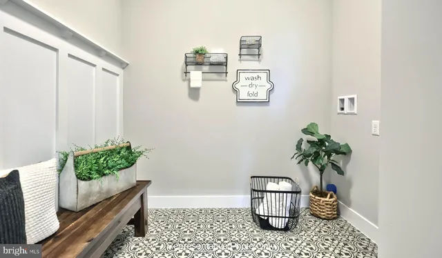 a room with painting and flower pot