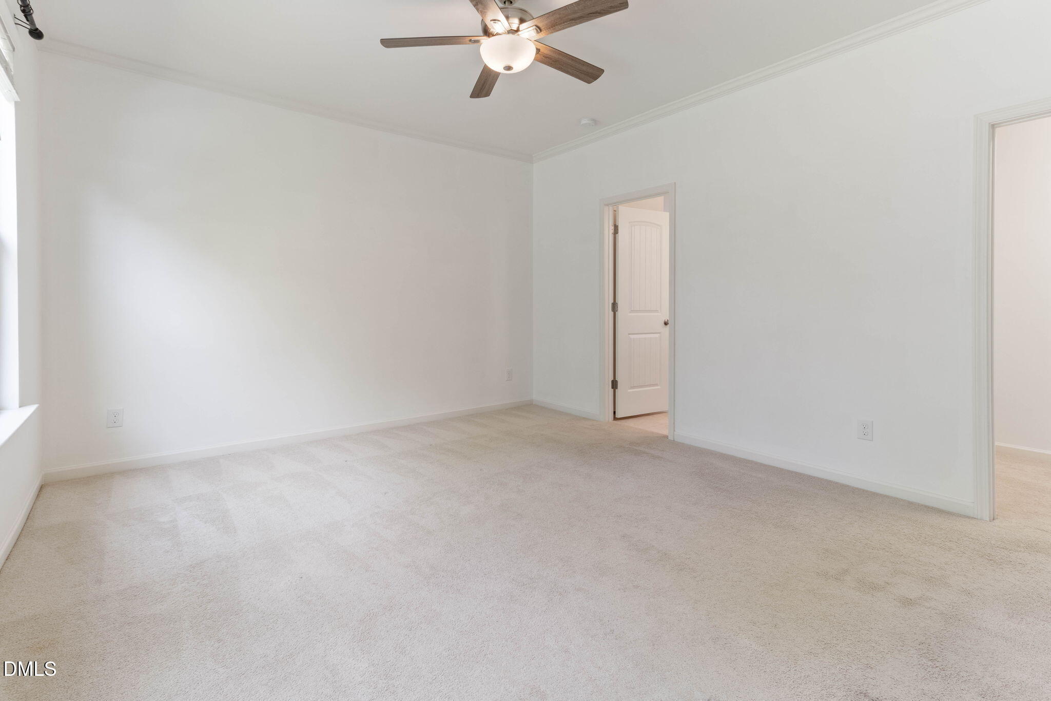 429 Mockingbird Lane Mebane, NC 27302 - Photo 15 of 44 an empty room with closet and a ceiling fan