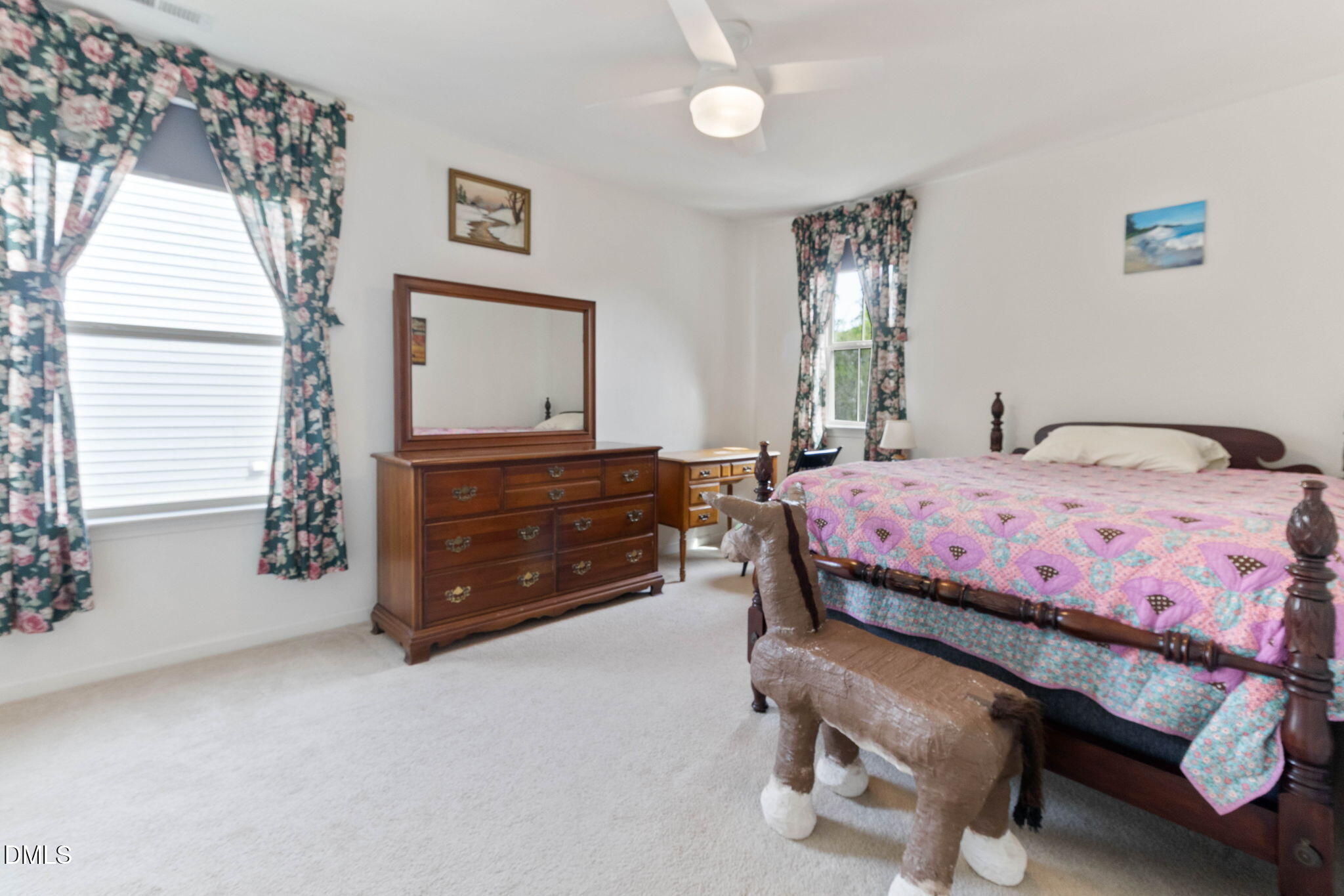 429 Mockingbird Lane Mebane, NC 27302 - Photo 19 of 44 a bedroom with a bed and a dresser