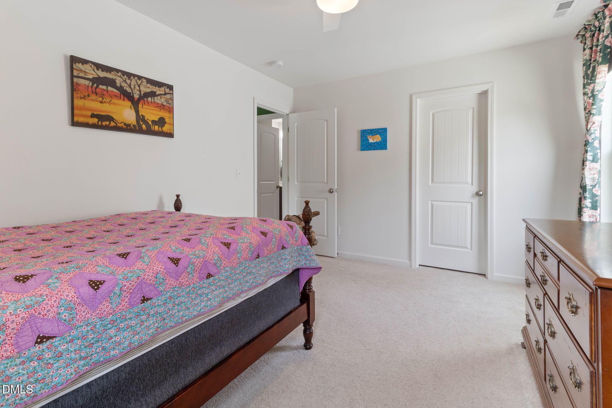 429 Mockingbird Lane Mebane, NC 27302 - Photo 20 of 44 a bedroom with a bed and a dresser in it