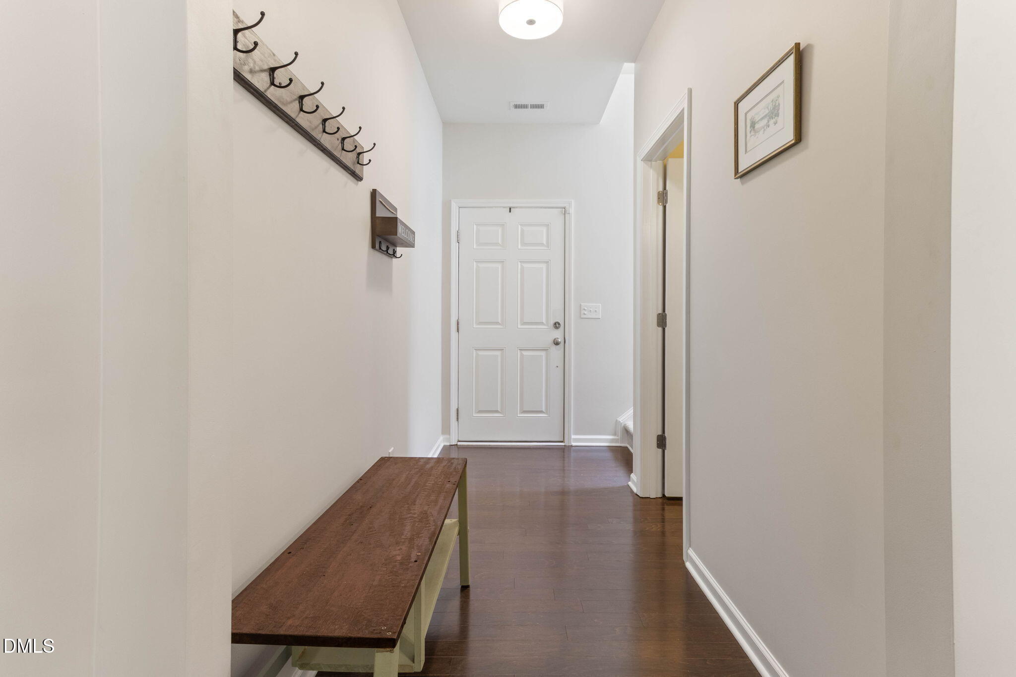 429 Mockingbird Lane Mebane, NC 27302 - Photo 28 of 44 a view of a hallway with wooden floor and entryway