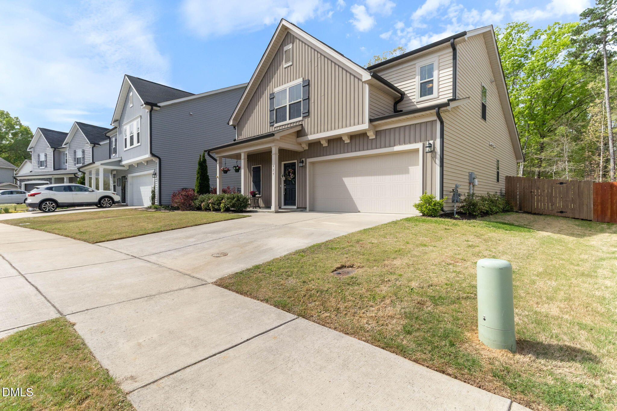 429 Mockingbird Lane Mebane, NC 27302 - Photo 2 of 44 a front view of a house with a yard