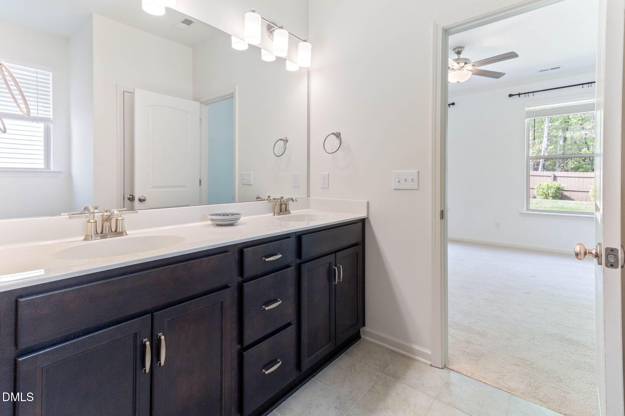 429 Mockingbird Lane Mebane, NC 27302 - Photo 36 of 44 a bathroom with a sink double vanity and a mirror