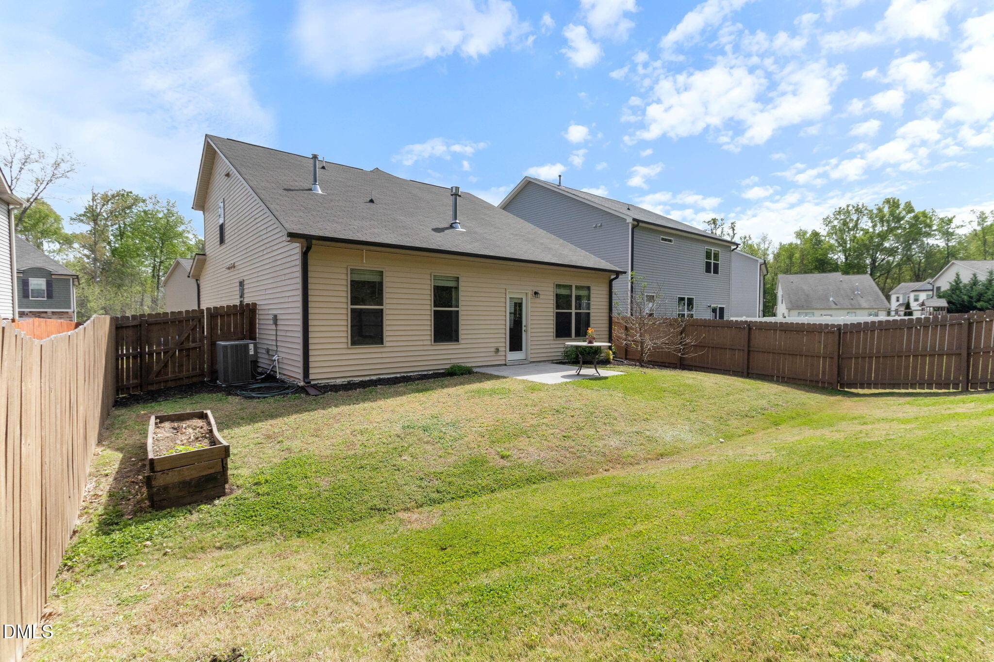 429 Mockingbird Lane Mebane, NC 27302 - Photo 42 of 44 a backyard of a house with table and chairs