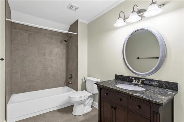 a bathroom with a bathtub and a sink