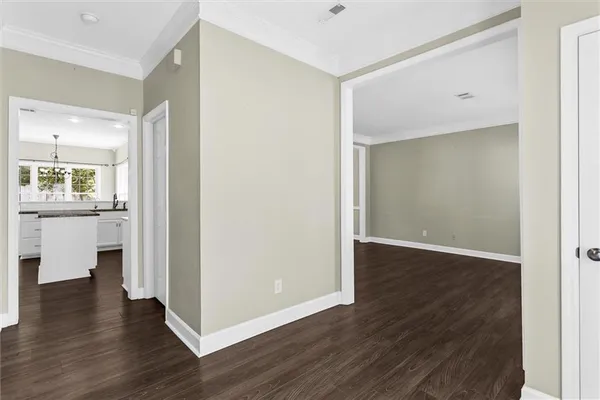 a view of a kitchen cabinets and wooden floor