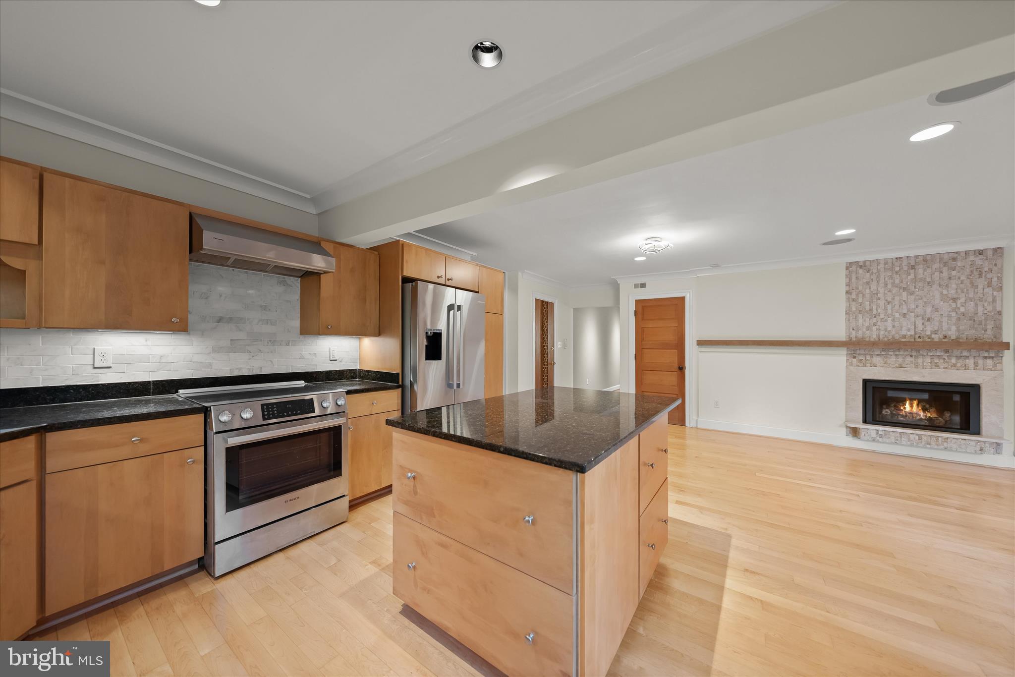 5104 Scarsdale Road Bethesda, MD 20816 - Photo 17 of 68 a kitchen with stainless steel appliances granite countertop a stove and a sink
