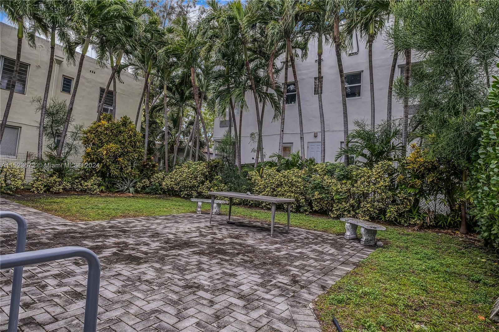 7936 Harding Avenue Miami Beach, FL 33141 - Photo 15 of 18 a view of garden with patio
