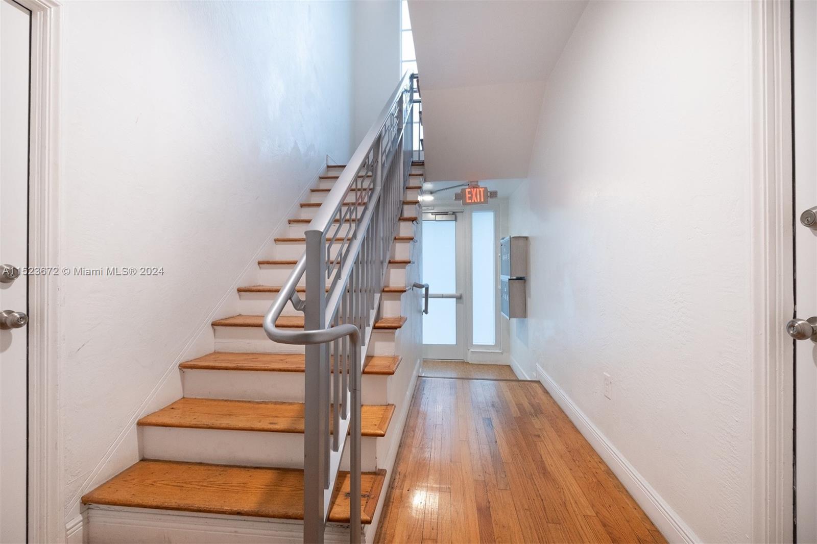 7936 Harding Avenue Miami Beach, FL 33141 - Photo 6 of 18 a view of entryway and hall with wooden floor