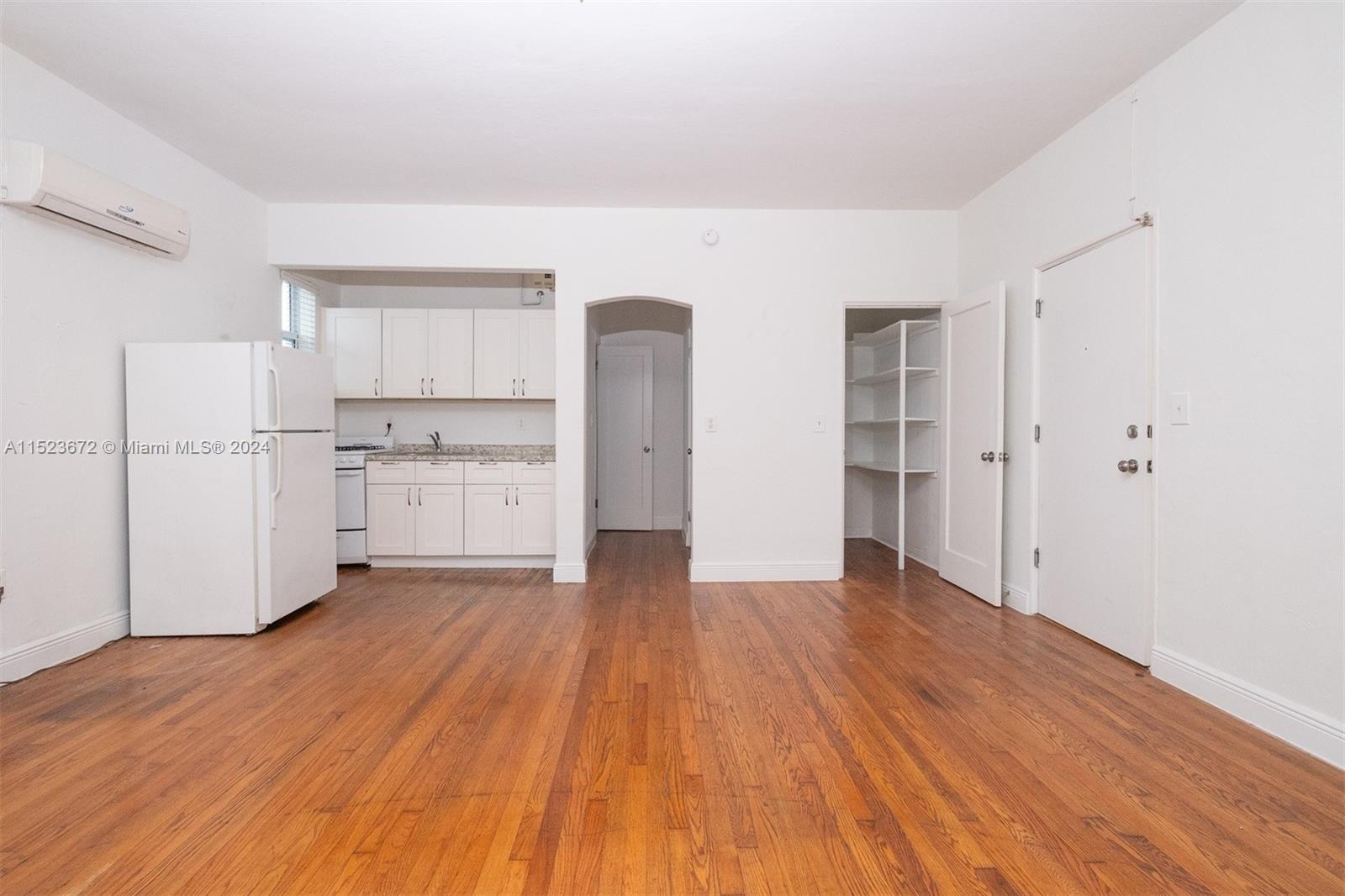 7936 Harding Avenue Miami Beach, FL 33141 - Photo 8 of 18 a view of kitchen with wooden floor