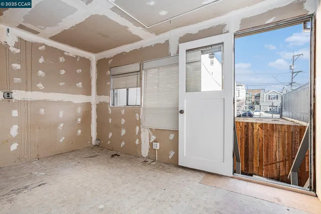 a view of a hallway with a bathroom
