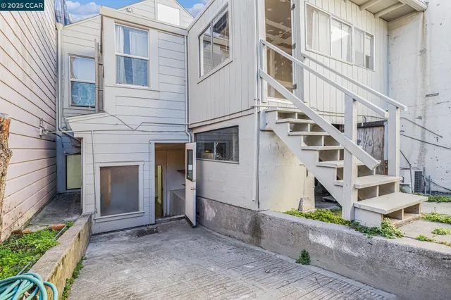 a view of a white building among the street
