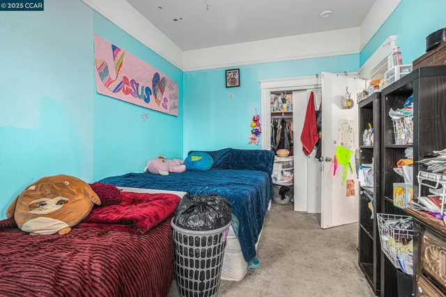 a bedroom with a bed and dresser