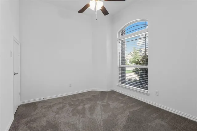 an empty room with a empty space and a window