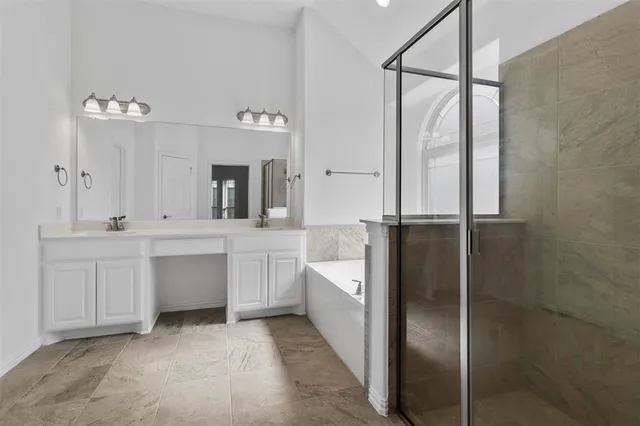 a bathroom with a double vanity sink and a mirror