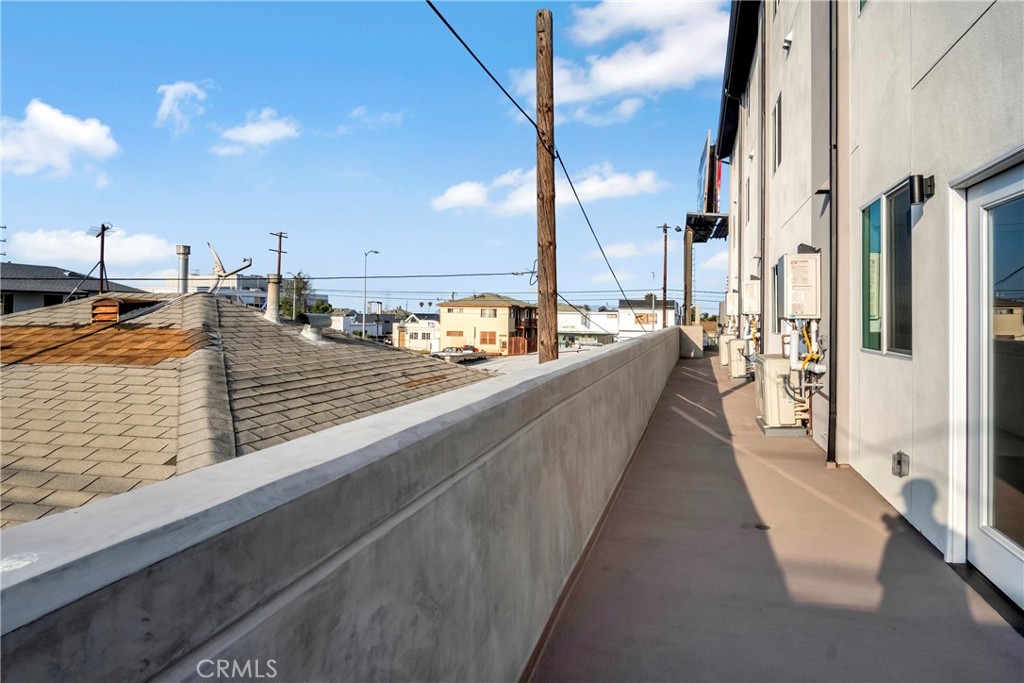 10035 South Western Avenue, Unit 101 Los Angeles, CA 90047 - Photo 13 of 22 a view of a balcony with many windows