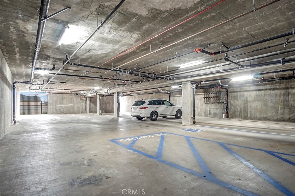 10035 South Western Avenue, Unit 101 Los Angeles, CA 90047 - Photo 18 of 22 a view of parking garage with cars