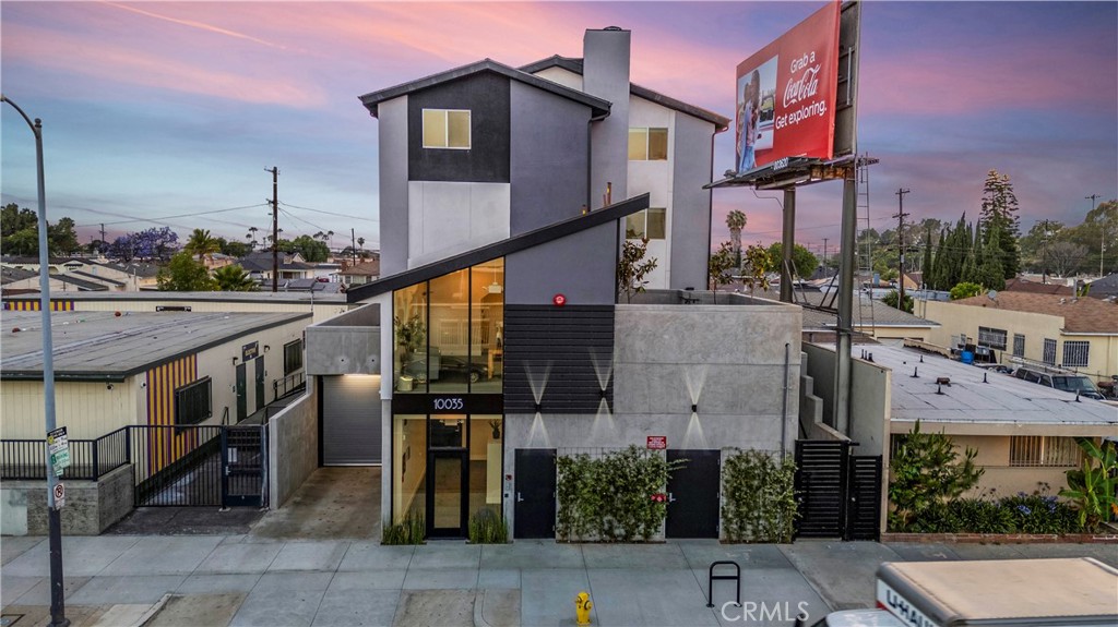 10035 South Western Avenue, Unit 101 Los Angeles, CA 90047 - Photo 3 of 22 a view of a building with many windows