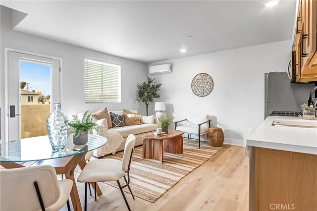 a view of a livingroom with furniture and entryway