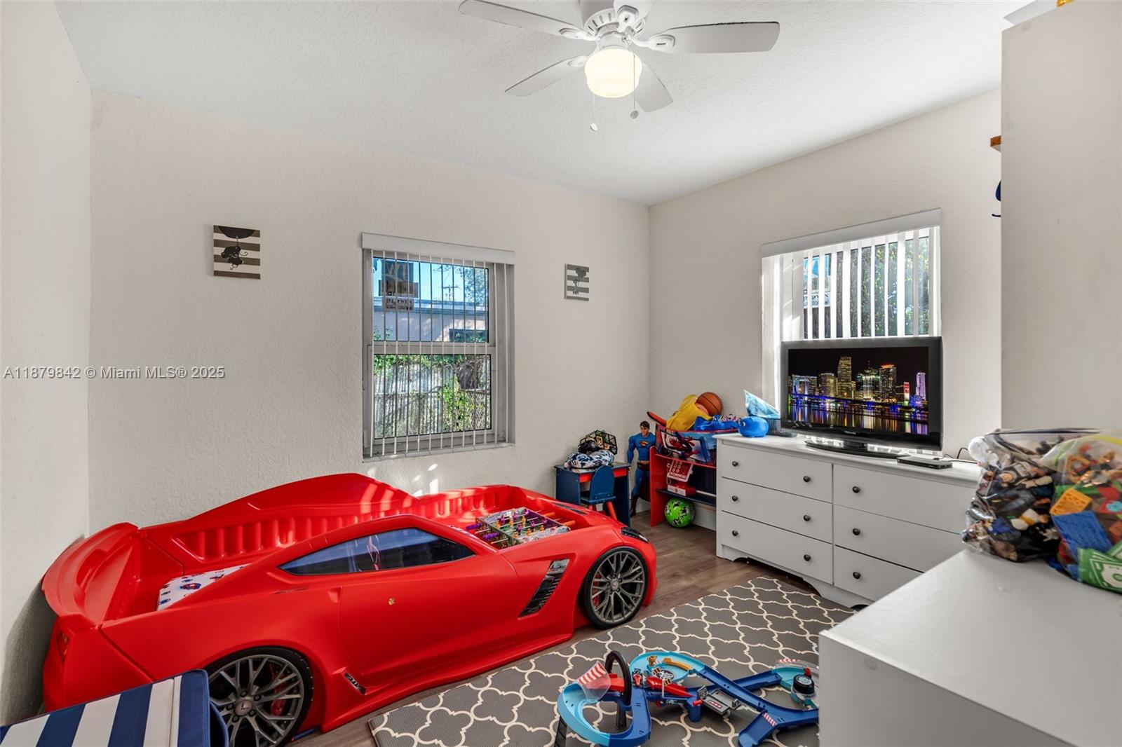 114 Marion Road West Park, FL 33023 - Photo 17 of 24 a bedroom with a bed and a chandelier