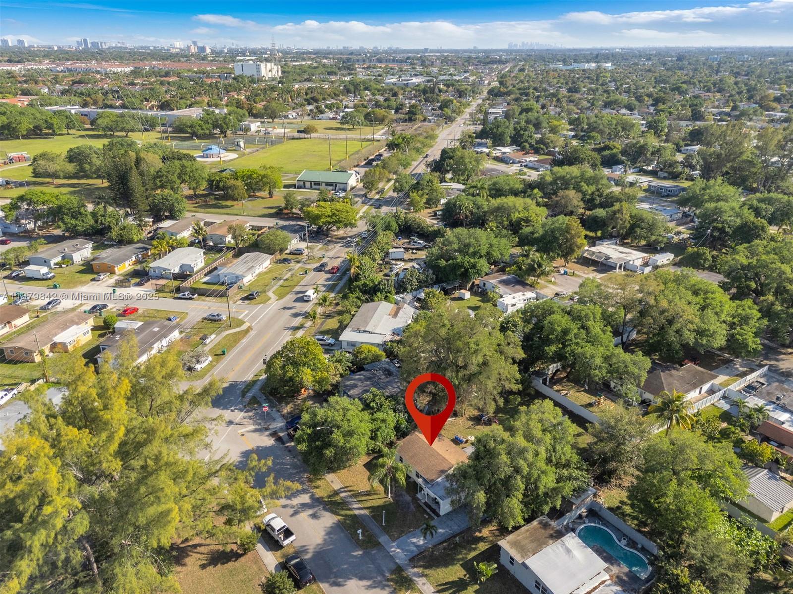 114 Marion Road West Park, FL 33023 - Photo 21 of 24 an aerial view of residential house with yard and mountain view in back