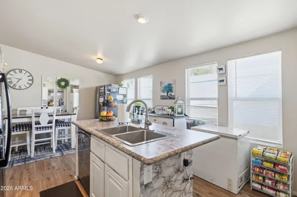 a kitchen with a sink a counter top space and appliances