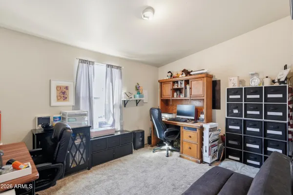 a view of a workspace with furniture and toys