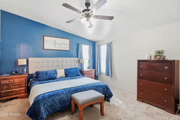 a bedroom with a bed and a dresser