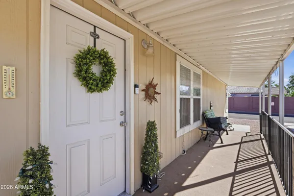 a view of a porch with seating space