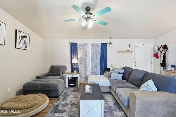 a living room with furniture and a rug