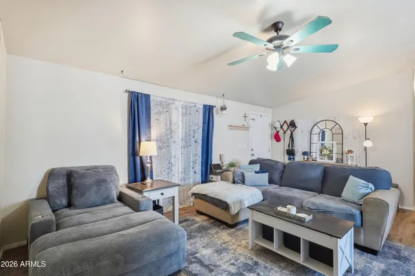 a living room with furniture and a large window