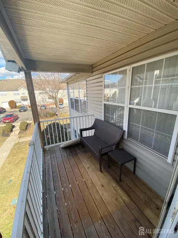a view of a chairs in wooden deck
