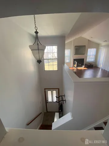 a room with a couch and a chandelier