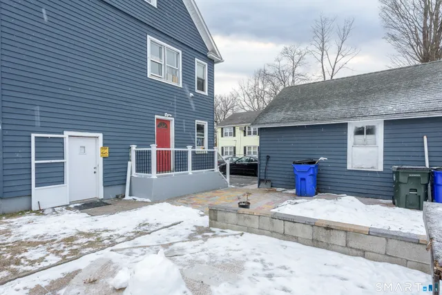 a front view of a house with a outdoor space