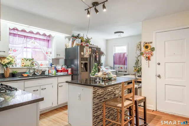 a kitchen with a sink and cabinets