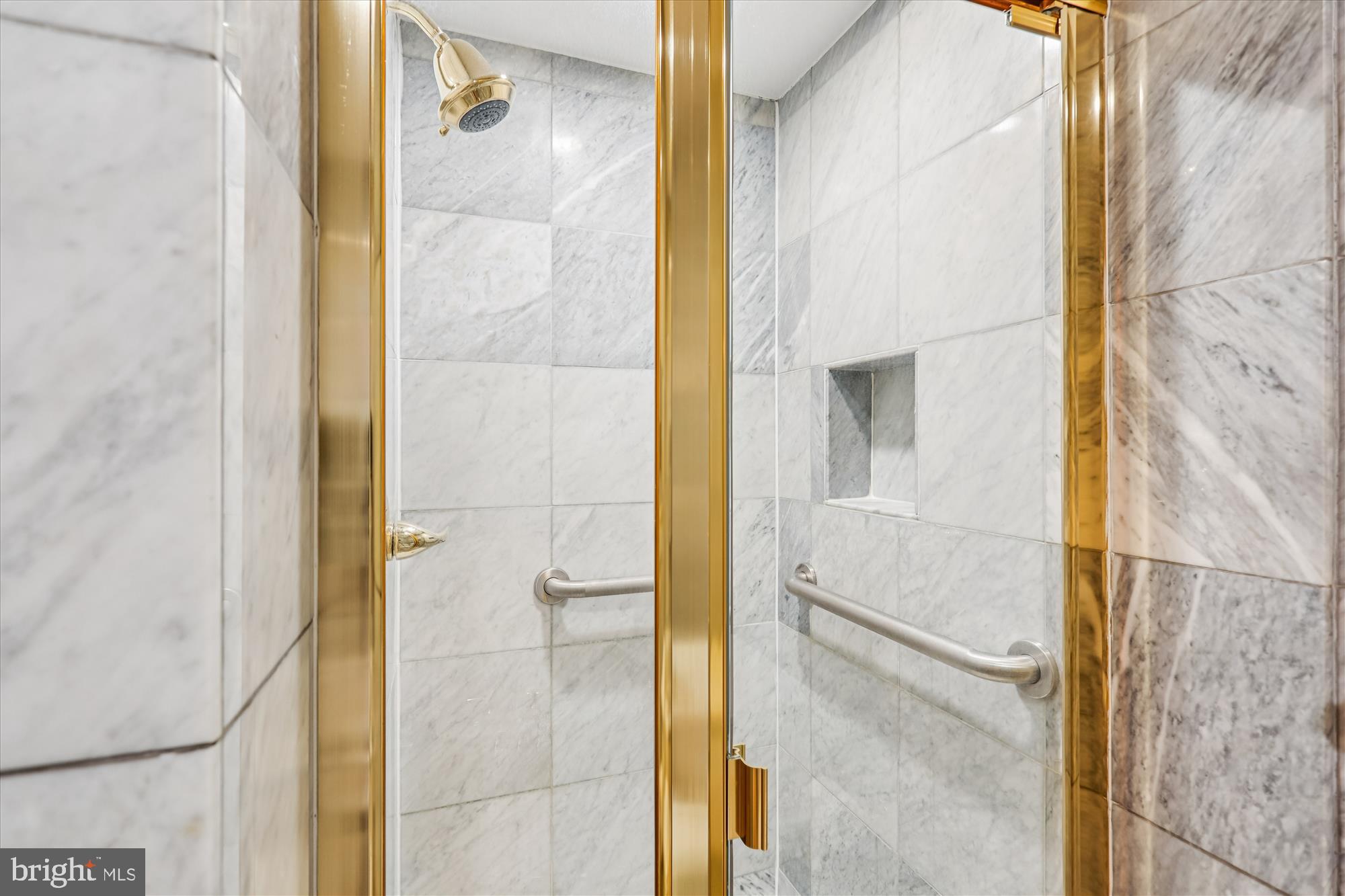 3801 Canterbury Road, Unit 404 Baltimore, MD 21218 - Photo 13 of 37 a bathroom with a shower