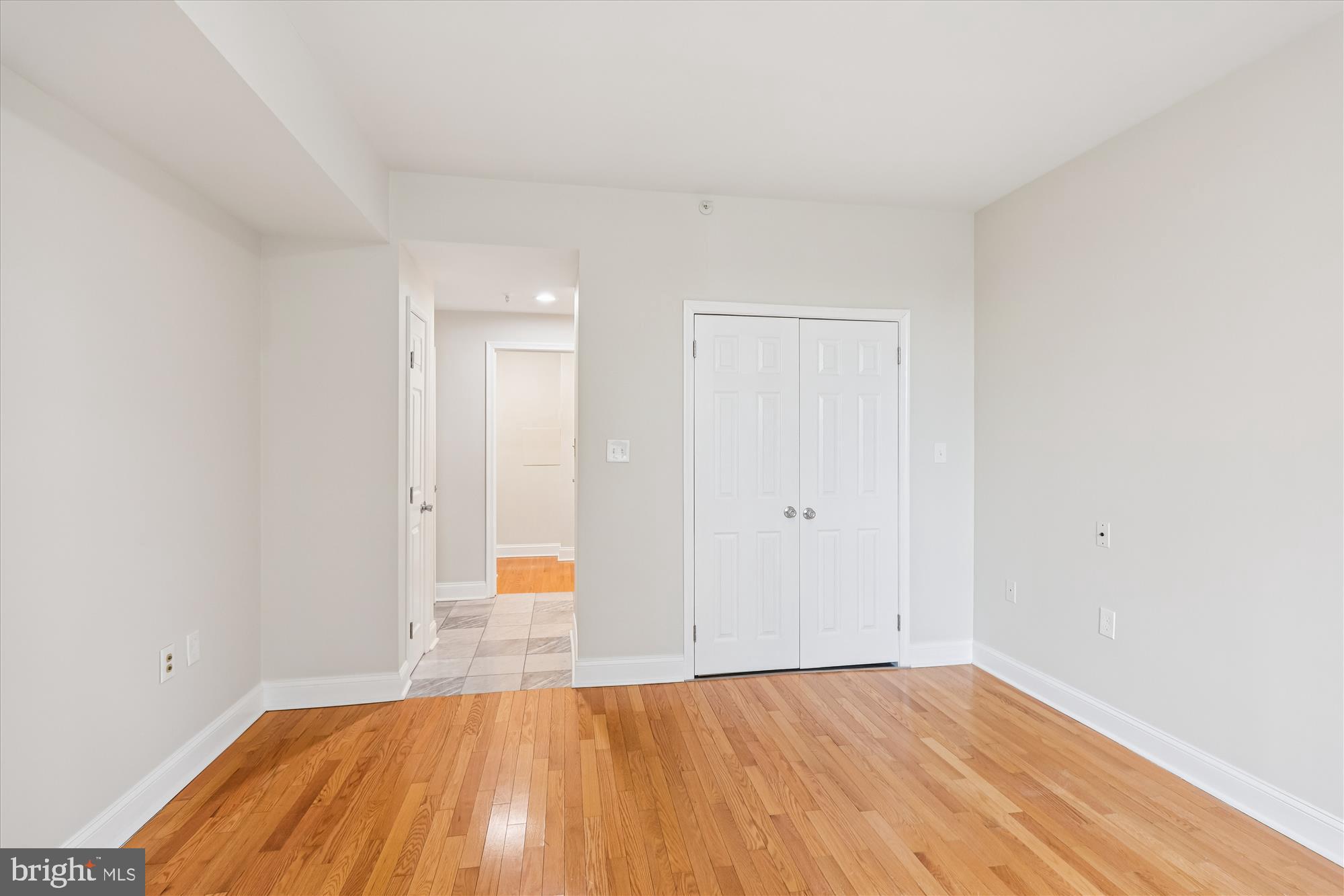 3801 Canterbury Road, Unit 404 Baltimore, MD 21218 - Photo 16 of 37 a view of an empty room and wooden floor